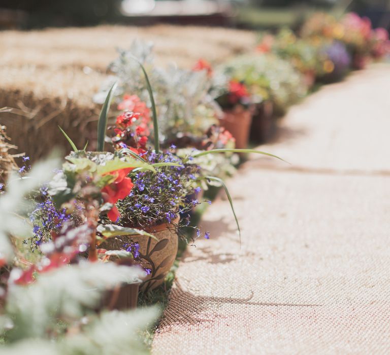 Outdoor Wedding Ceremony With Haybale Seating & Chalkboard Sign