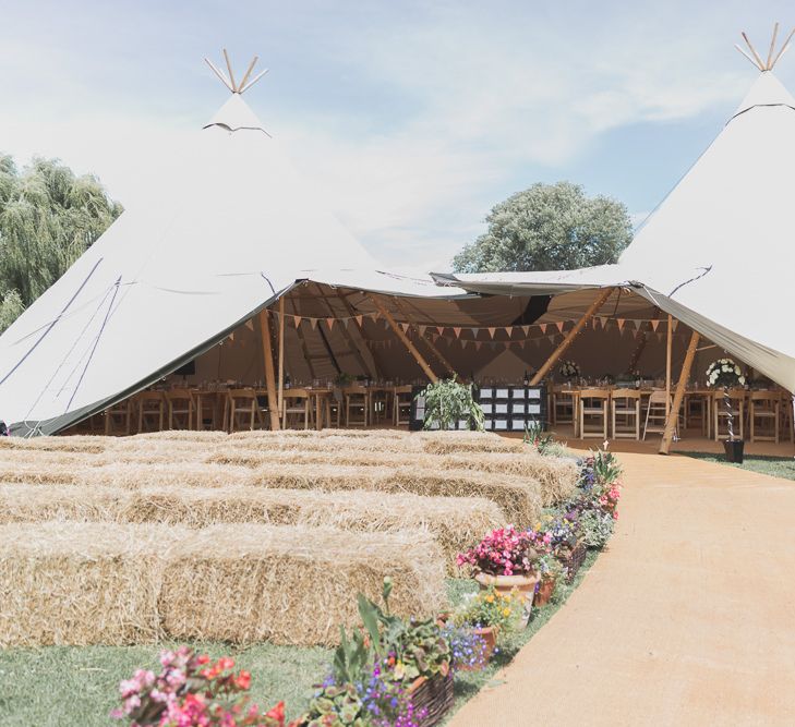 Outdoor Wedding Ceremony With Haybale Seating & Chalkboard Sign