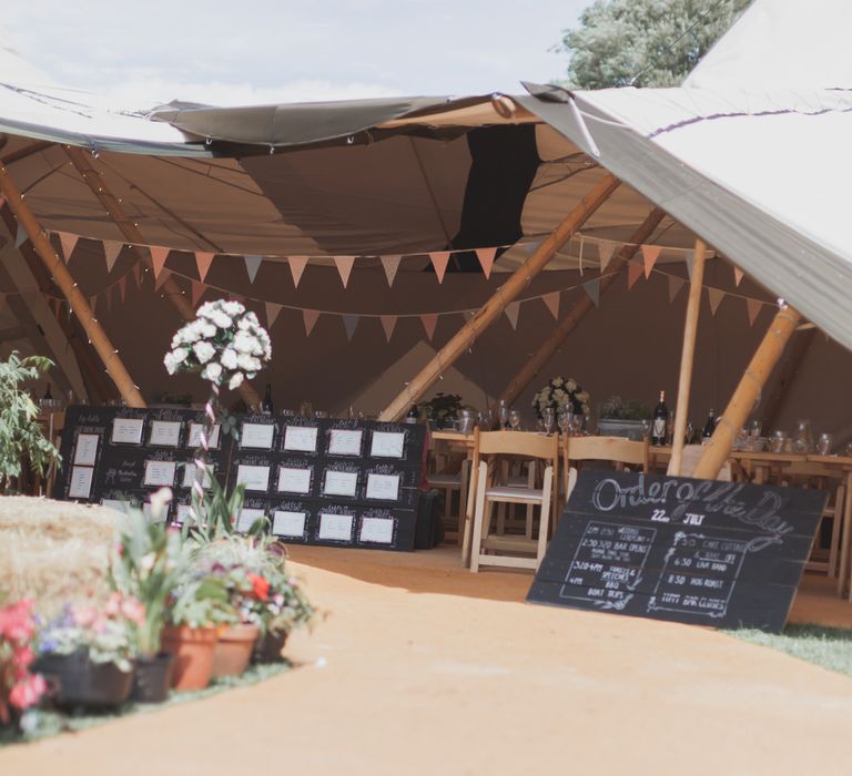 Outdoor Wedding Ceremony With Haybale Seating & Chalkboard Sign