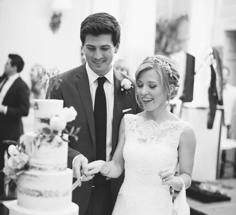 Cutting the Cake | Bride in Pronovias Gown | Groom in Navy J.Crew Suit | Elegant, Pastel Wedding at Hedsor House, Buckinghamshire | M & J Photography | Shoot It Yourself Films