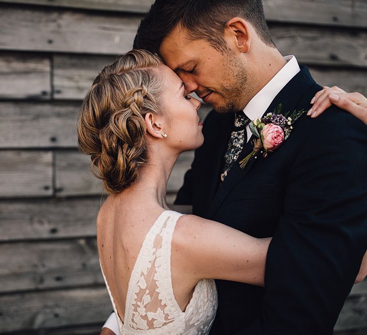 Bride in Catherine Deane Tamsin Wedding Dress & Groom in Paul Smith Suit