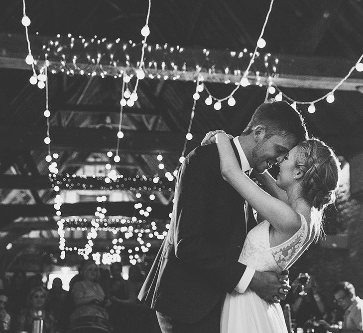 Bride in Catherine Deane Tamsin Wedding Dress & Groom in Paul Smith Suit