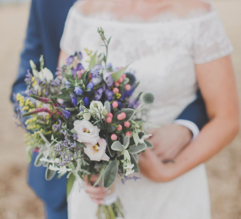 Bride in Lace Sincerity Bridal Wedding Dress & Wild Flower Bouquet