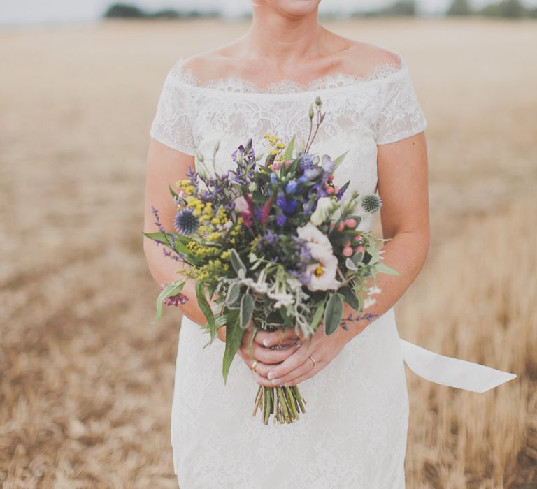 Bride in Lace Sincerity Bridal Wedding Dress & Wild Flower Bouquet