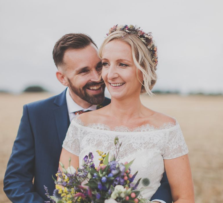 Bride in Lace Sincerity Bridal Wedding Dress & Groom in navy Ted Baker Suit