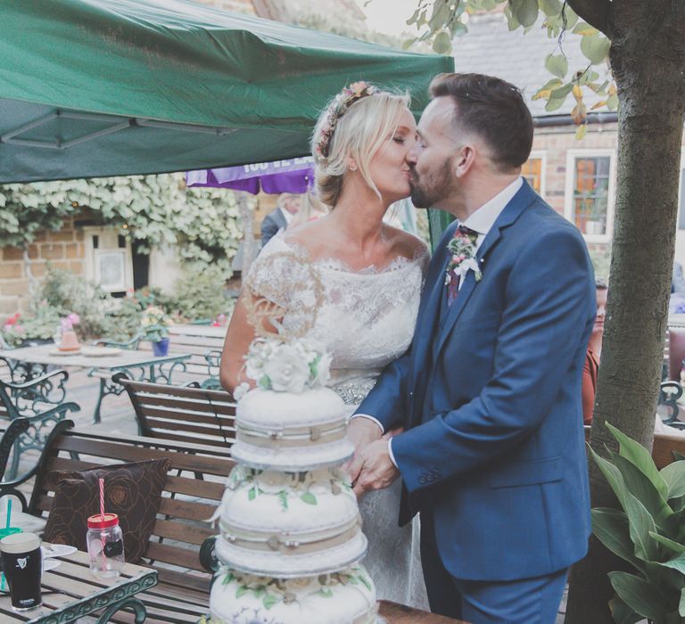 Bride & Groom Cutting The Cake