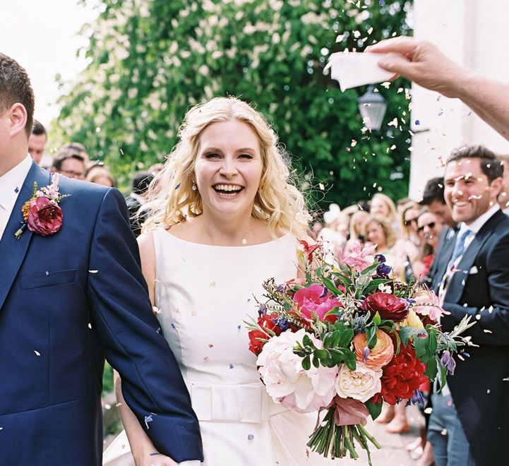 Confetti Moment | Bride in Sassi Holford Gown | Groom in Neal & Palmer Navy Suit | Classic Wedding at Trafalgar Tavern, Greenwich, London | Ann-Kathrin Koch Photography