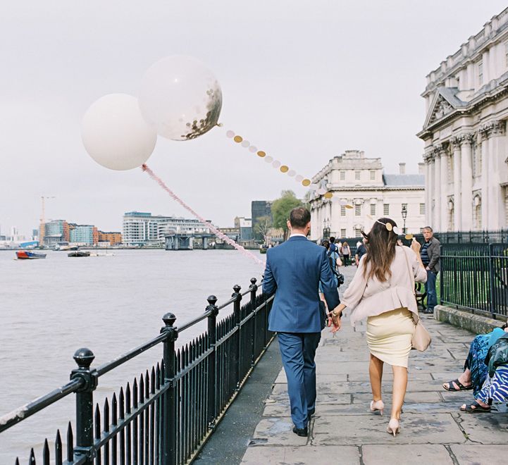 Wedding Guests with Giant Confetti Filled Balloon with Tissue Tassel | Classic Wedding at Trafalgar Tavern, Greenwich, London | Ann-Kathrin Koch Photography