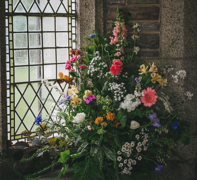 Brightly Coloured Church Floral Arrangement