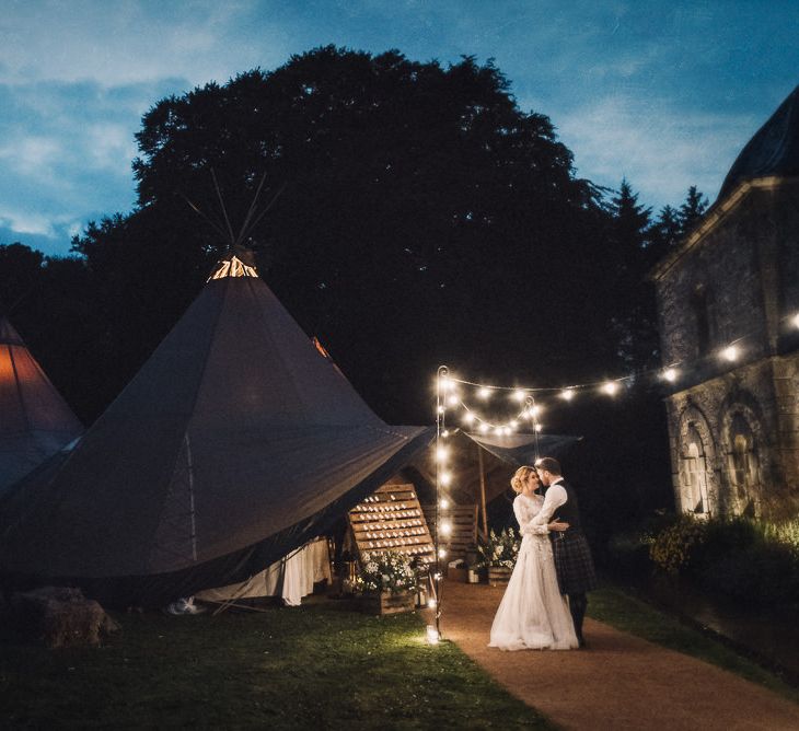 Festoon Lights For A Tipi Wedding // Rainy Tipi Wedding At The Coach House at Kinross House Scotland With Bride In Embellished Bespoke Dress And Images From Photos By Zoe