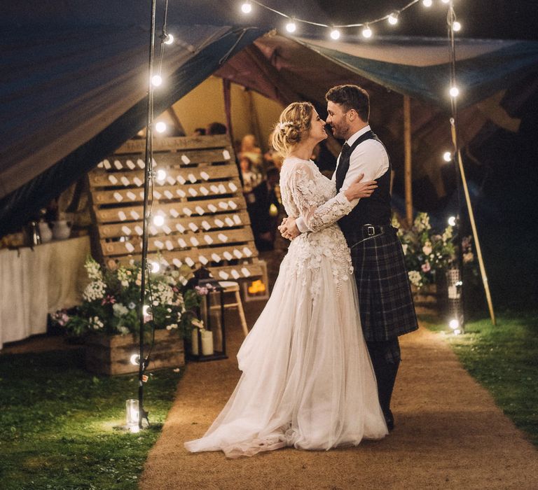 Festoon Lights For A Tipi Wedding // Rainy Tipi Wedding At The Coach House at Kinross House Scotland With Bride In Embellished Bespoke Dress And Images From Photos By Zoe