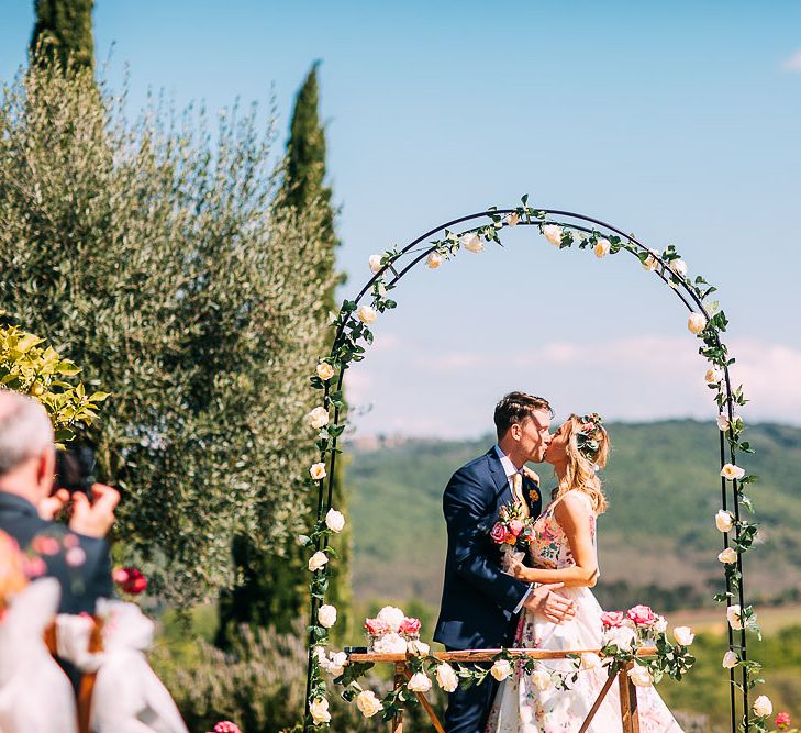 Floral Arch Altar | Bride in Charlotte Balbier Untamed Love Floral Wedding Dress | Groom in Navy Ted Baker Suit | Destination Wedding at Casa Cornacchi in Italy | Albert Palmer Photography