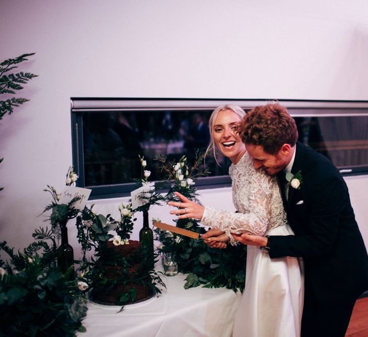 Bride & Groom Cutting The Cake