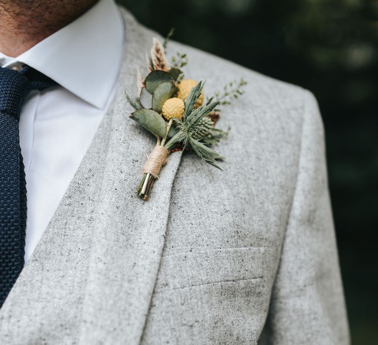 Rustic Buttonhole For Groom In Pale Grey Suit