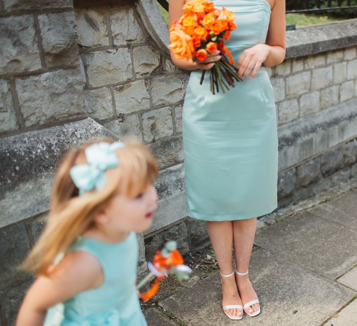 Teal Bridesmaids Dresses With Orange Bouquet