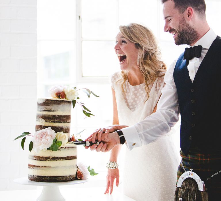 Halfpenny London Bride For An Intimate Wedding At Perseverance Works Shoreditch With Groom & Groomsmen In Kilts And Images From Adam Cherry Photography