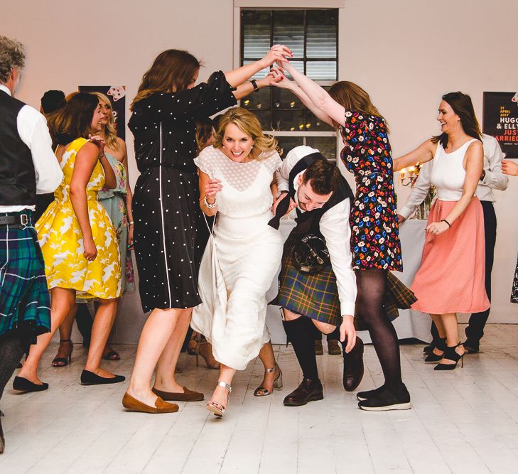 Halfpenny London Bride For An Intimate Wedding At Perseverance Works Shoreditch With Groom & Groomsmen In Kilts And Images From Adam Cherry Photography