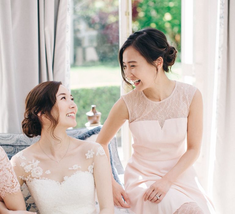 Bride in Bespoke Illusion Neck Gown & Bridesmaid in Pale Pink Dress | M and J Photography