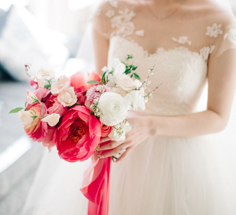 Bride in Bespoke Gown with Coral Peony & Ranunculus Bouquet | M and J Photography