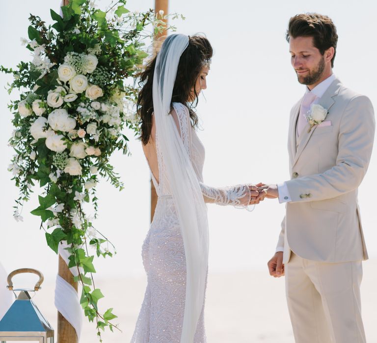 Beach Wedding Ceremony | Bride in Inbal Dror Wedding Dress | Groom in Beige Suit | Jade Osborne Photography | The Amazing Rabbit Films