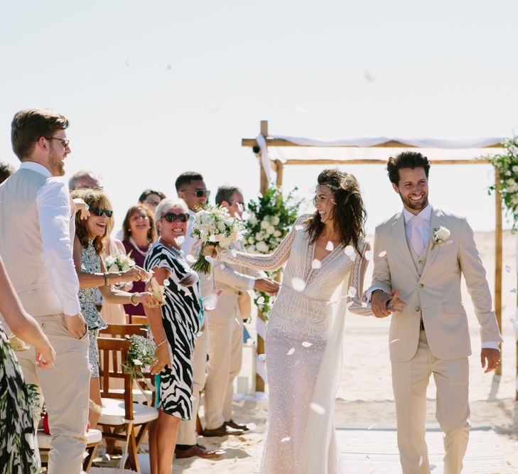 Beach Wedding Ceremony | Bride in Inbal Dror Wedding Dress | Groom in Beige Suit | Jade Osborne Photography | The Amazing Rabbit Films