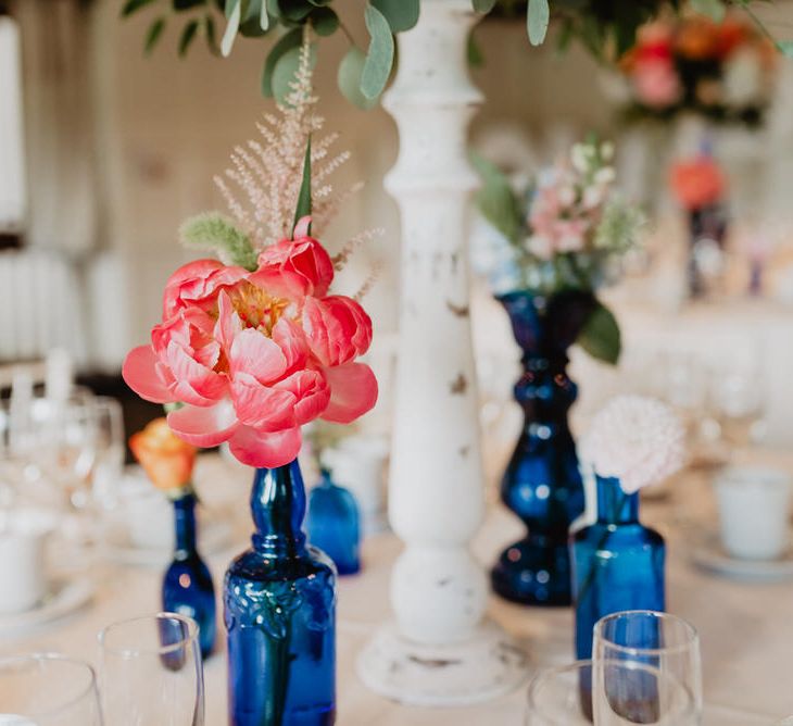 Peonies In Blue Glass Bottles For Wedding