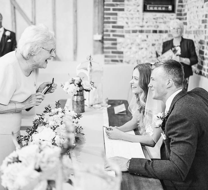 Wedding Guests | Bridesmaids in Peach Chi Chi London Dresses | Bride in Warren Watters Gown | Peach & White Wedding at Upwaltham Barns | White Stag Wedding Photography