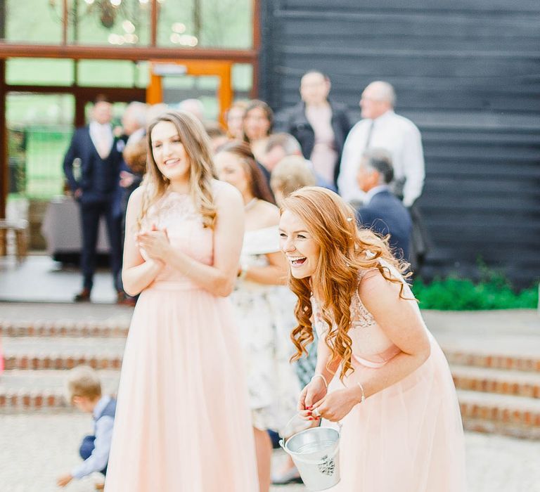 Bridesmaids in Peach Chi Chi London Dresses | Peach & White Wedding at Upwaltham Barns | White Stag Wedding Photography