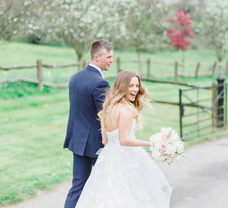 Bride in Warren Watters Gown | Groom in Marks and Spencer Suit | Peach & White Wedding at Upwaltham Barns | White Stag Wedding Photography