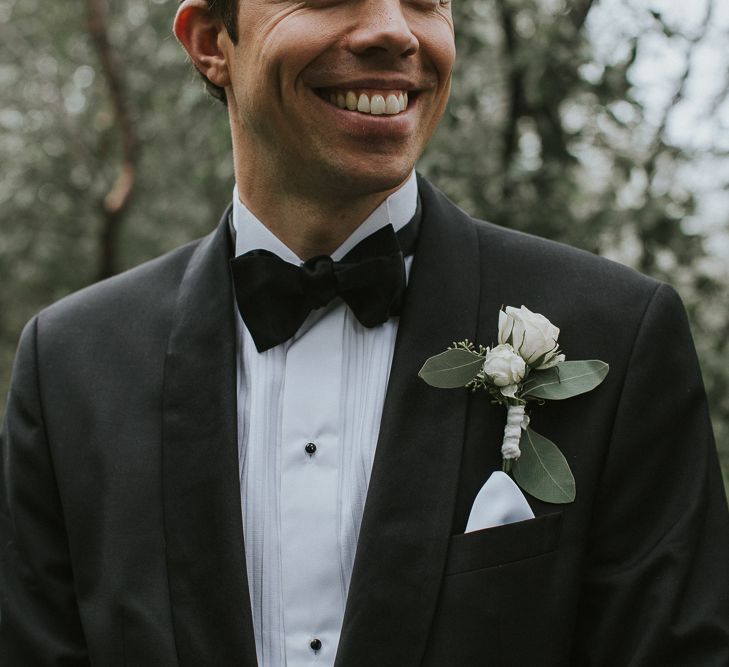 White Buttonhole | Groom in Hugo Boss Tuxedo | Rustic Barn Wedding in Norway | Christin Eide Photography