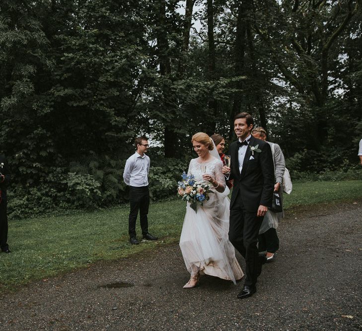 Bride in Willowby Watters 'Amelia' Gown | Groom in Hugo Boss Tuxedo | Rustic Barn Wedding in Norway | Christin Eide Photography