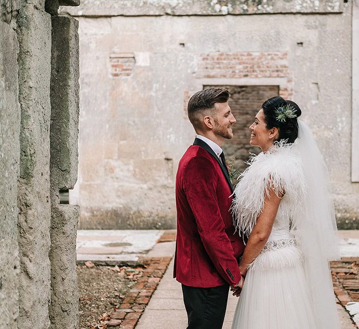 Groom in Red Velvet Jacket & Bride In Vintage Feather Dress