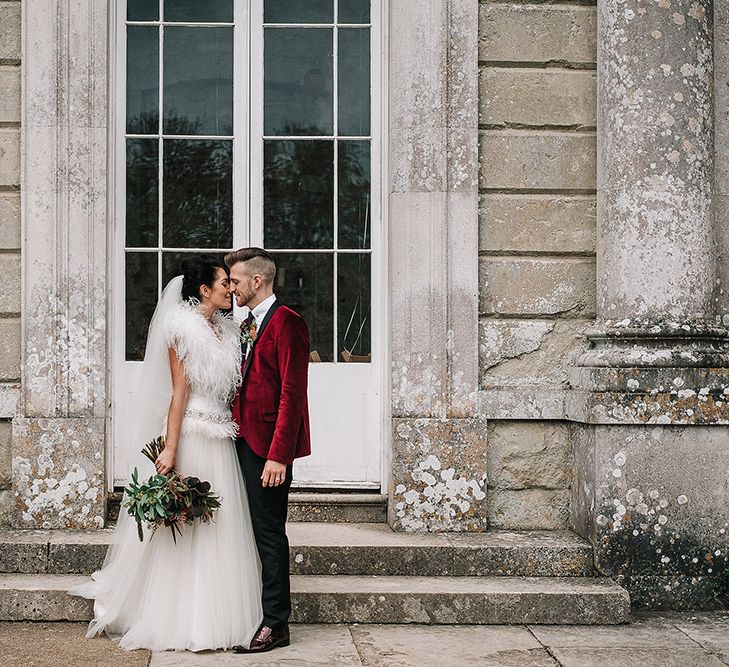 Groom in Red Velvet Jacket & Bride In Vintage Feather Dress