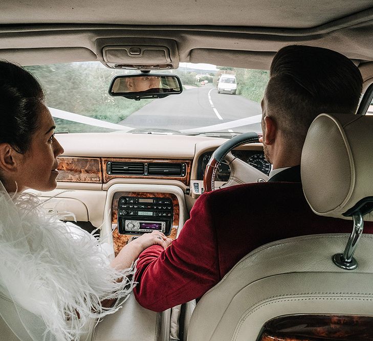 Groom in Red Velvet Jacket & Bride In Vintage Feather Dress