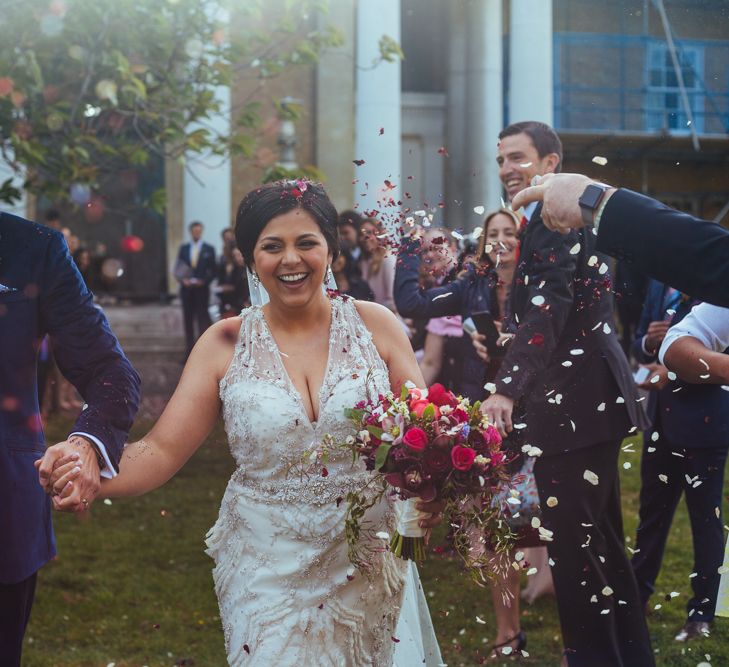 Confetti Moment | Bride in Lazaro Gown | Groom in Navy Ted Baker Suit | Helen Abraham Photography