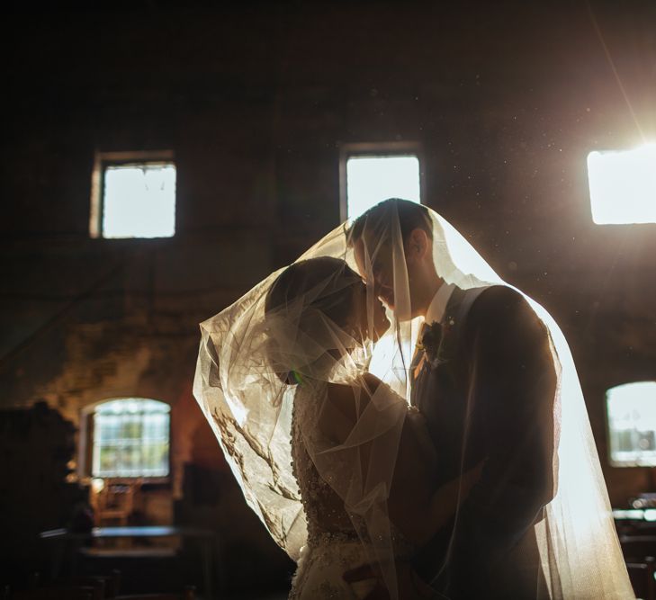 The Asylum | Bride in Lazaro Gown | Groom in Navy Ted Baker Suit | Helen Abraham Photography