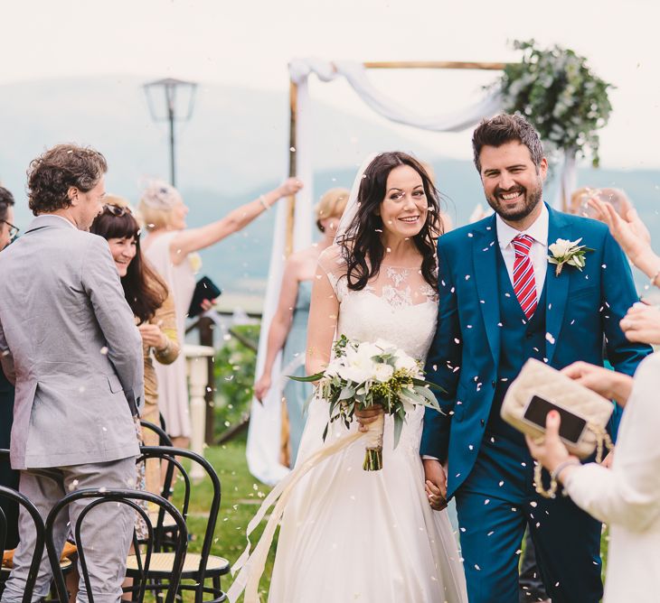 Outdoor Wedding Ceremony | Bride in Naomi Neoh | Groom in French Connection Suit