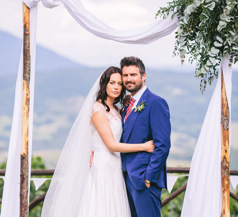 Bride in Naomi Neoh Gown & Groom in French Connection Suit