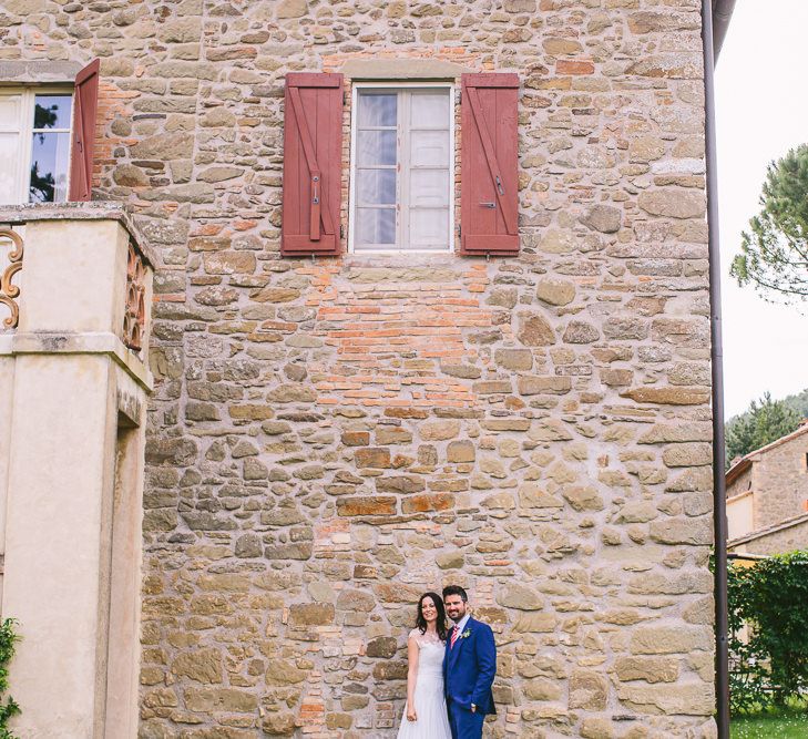 Bride in Naomi Neoh Gown & Groom in French Connection Suit