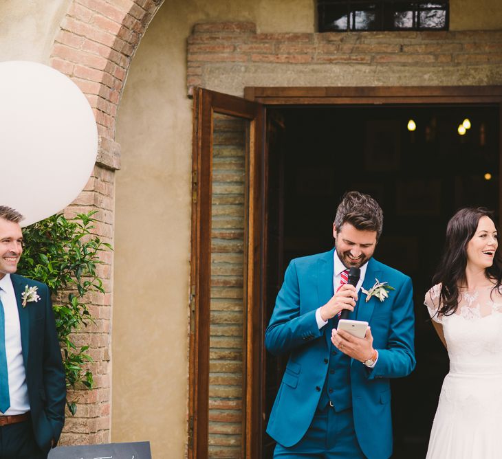 Bride in Naomi Neoh Gown & Groom in French Connection Suit