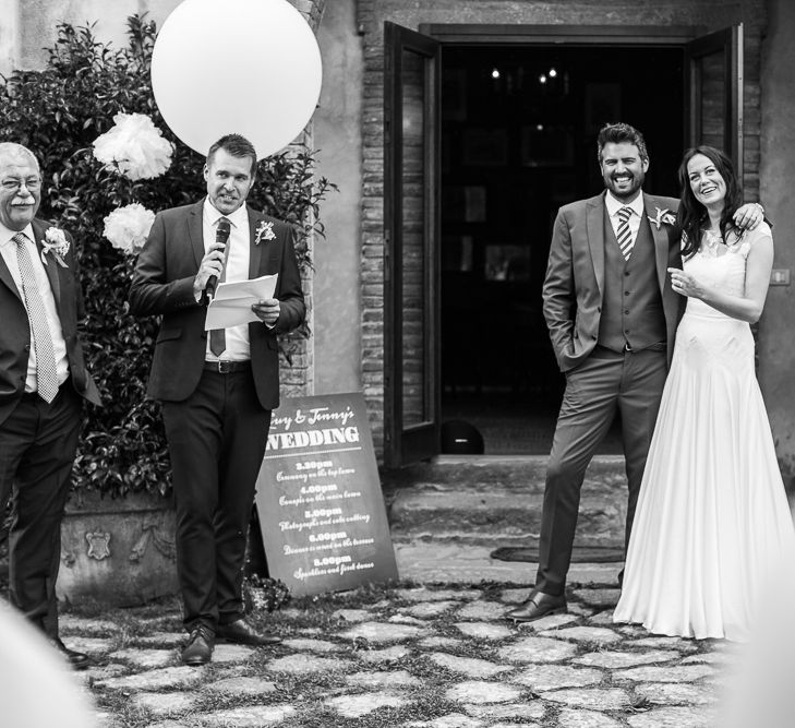 Bride in Naomi Neoh Gown & Groom in French Connection Suit