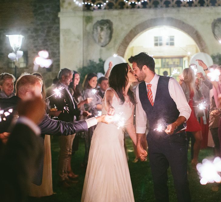 Bride Naomi Neoh Gown & Groom in French Connection Suit Sparkler Exit