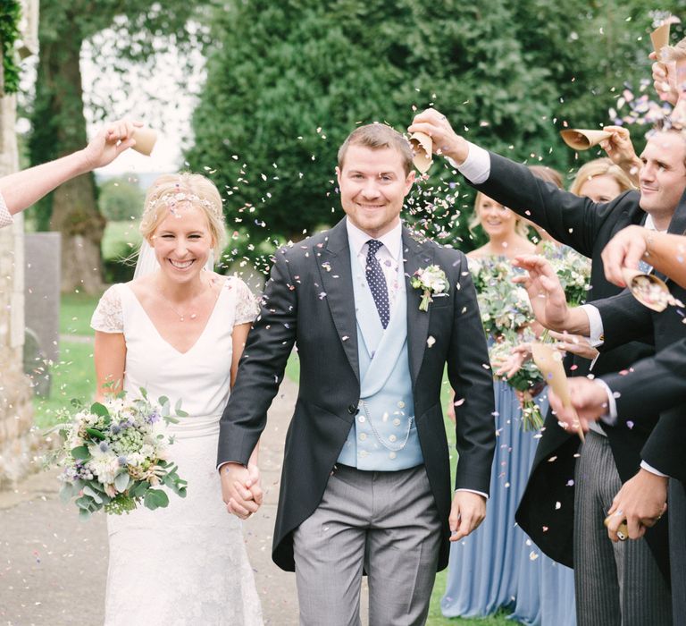 Confetti Moment with Bride in Charlie Brear Peyton Dress & Augustine Skirt & Groom in Traditional Tails