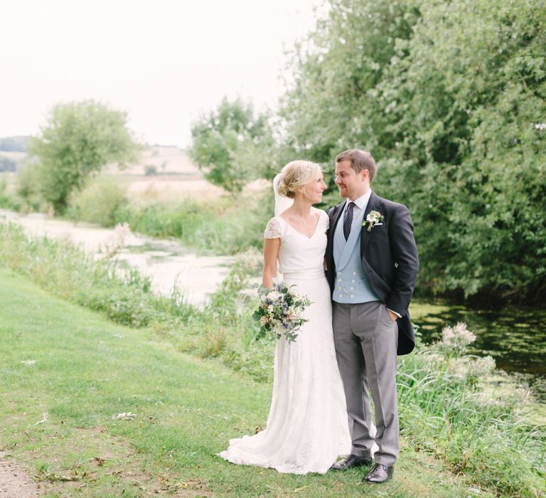 Bride in Charlie Brear Peyton Dress & Augustine Skirt & Groom in Traditional Morning Suit