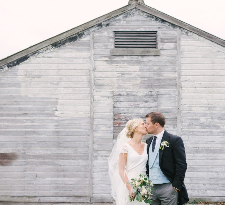 Bride in Charlie Brear Peyton Dress & Augustine Skirt & Groom in Traditional Morning Suit