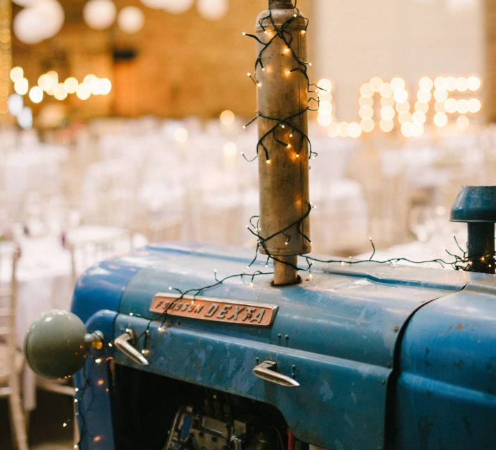 Tractor in Lantern Filled Rustic Barn Reception