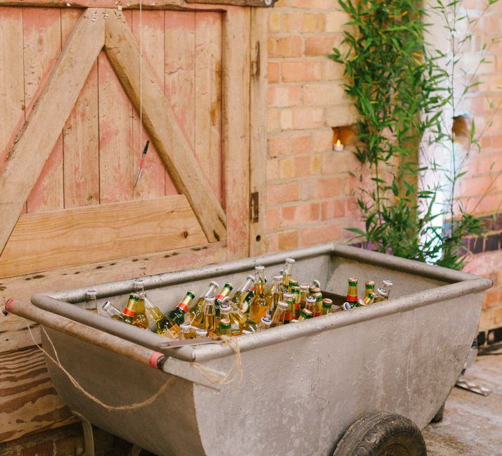 Metal Wheel Barrow Filled with Beer Bottles