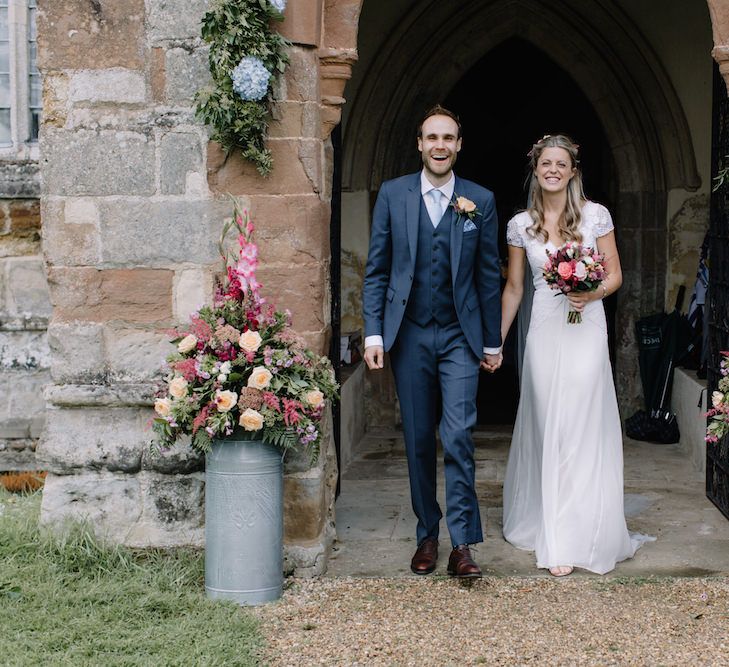 Bride in a Temperley Cressida Gown | Groom in Sandro Suit | Rural Wedding in a Sailcloth Tent on Stanford Hall Estate, Northamptonshire | Rebecca Goddard Photography