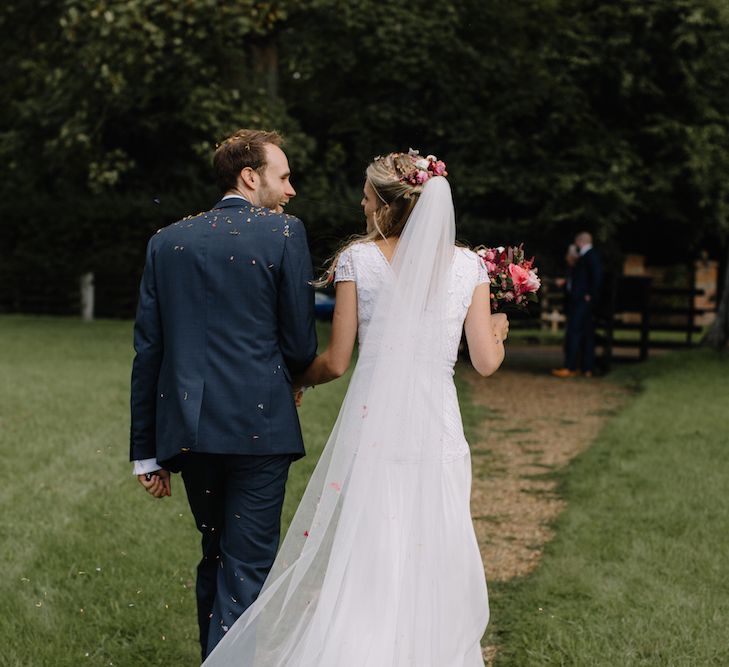 Bride in a Temperley Cressida Gown | Groom in Sandro Suit | Rural Wedding in a Sailcloth Tent on Stanford Hall Estate, Northamptonshire | Rebecca Goddard Photography