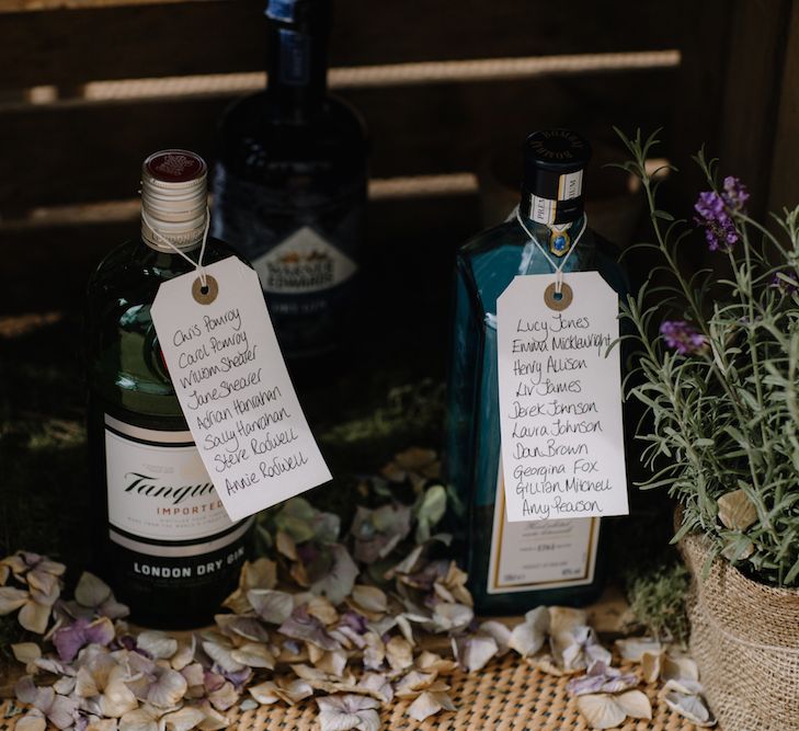 Rustic Wooden Crate & Gin Bottle Table Plan | Rural Wedding in a Sailcloth Tent on Stanford Hall Estate, Northamptonshire | Rebecca Goddard Photography